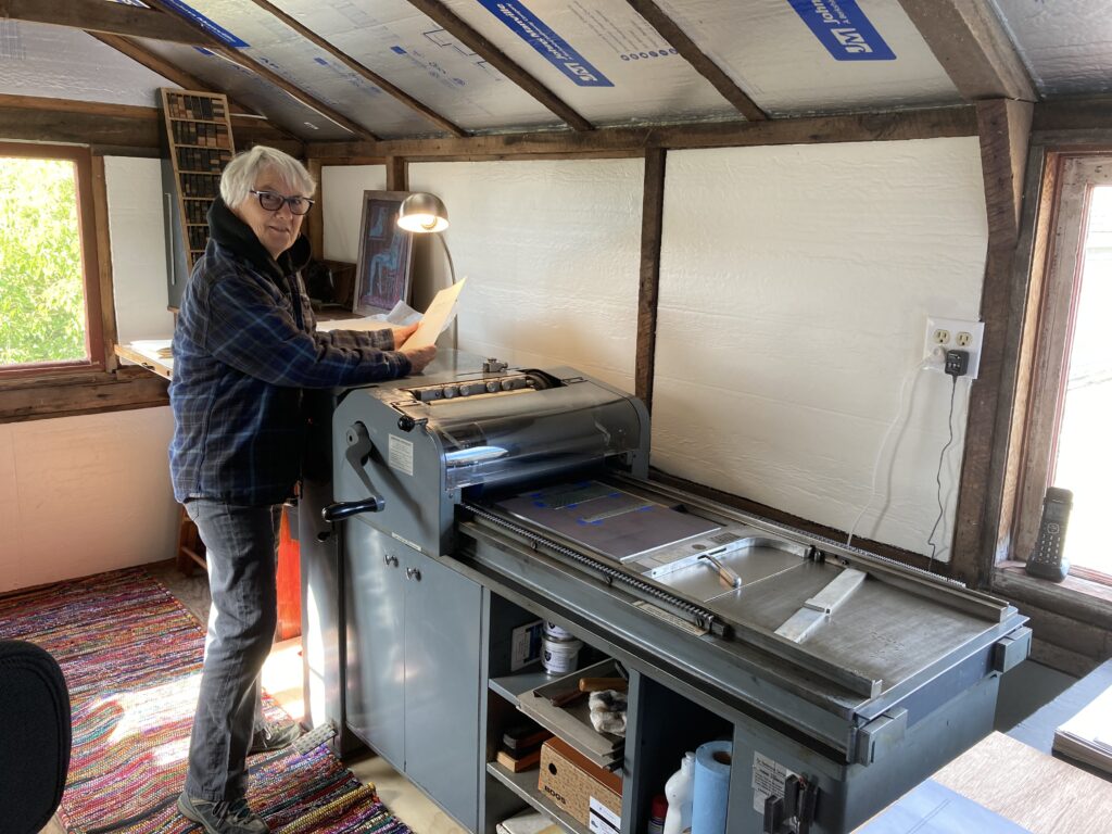 woman at work on printing press