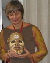 woman holding gold mask