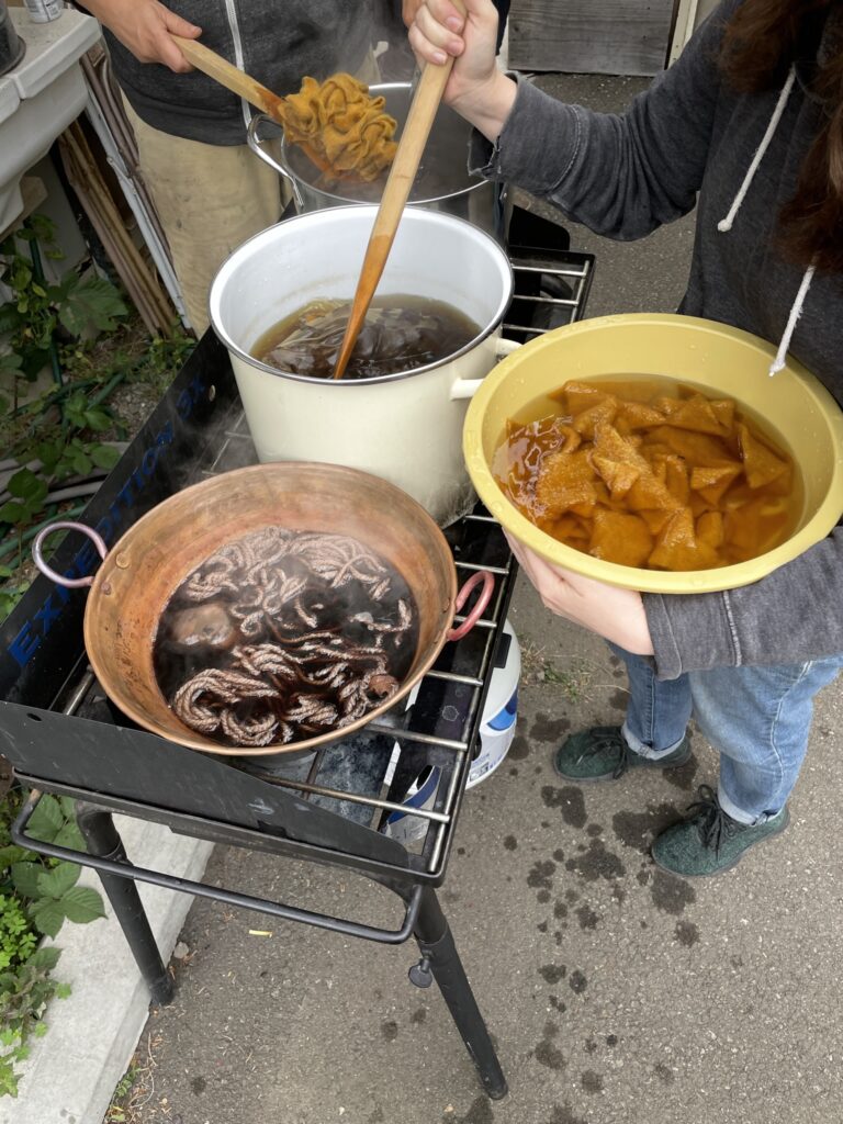 stirring pots of dye mushrooms