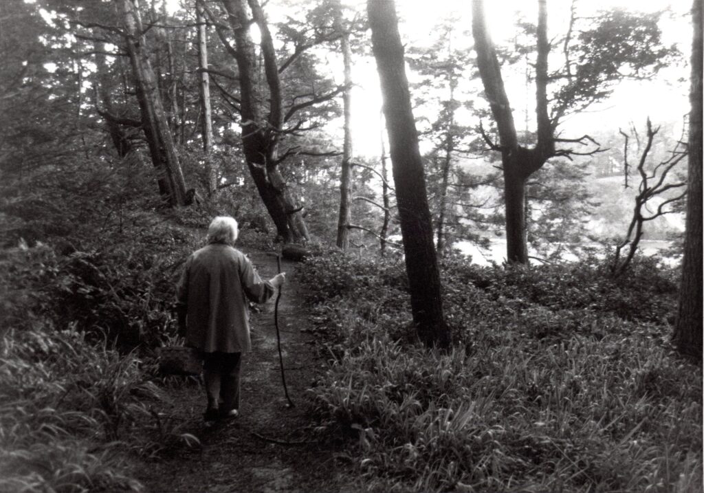 woman walking in dark woods