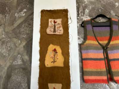 Embroidered hanging from IFFS 2025 exhibit