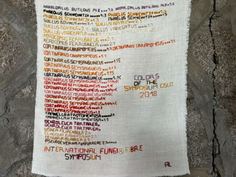 Embroidered hanging from IFFS 2025 exhibit