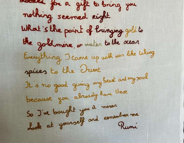 Embroidered hanging from IFFS 2025 exhibit